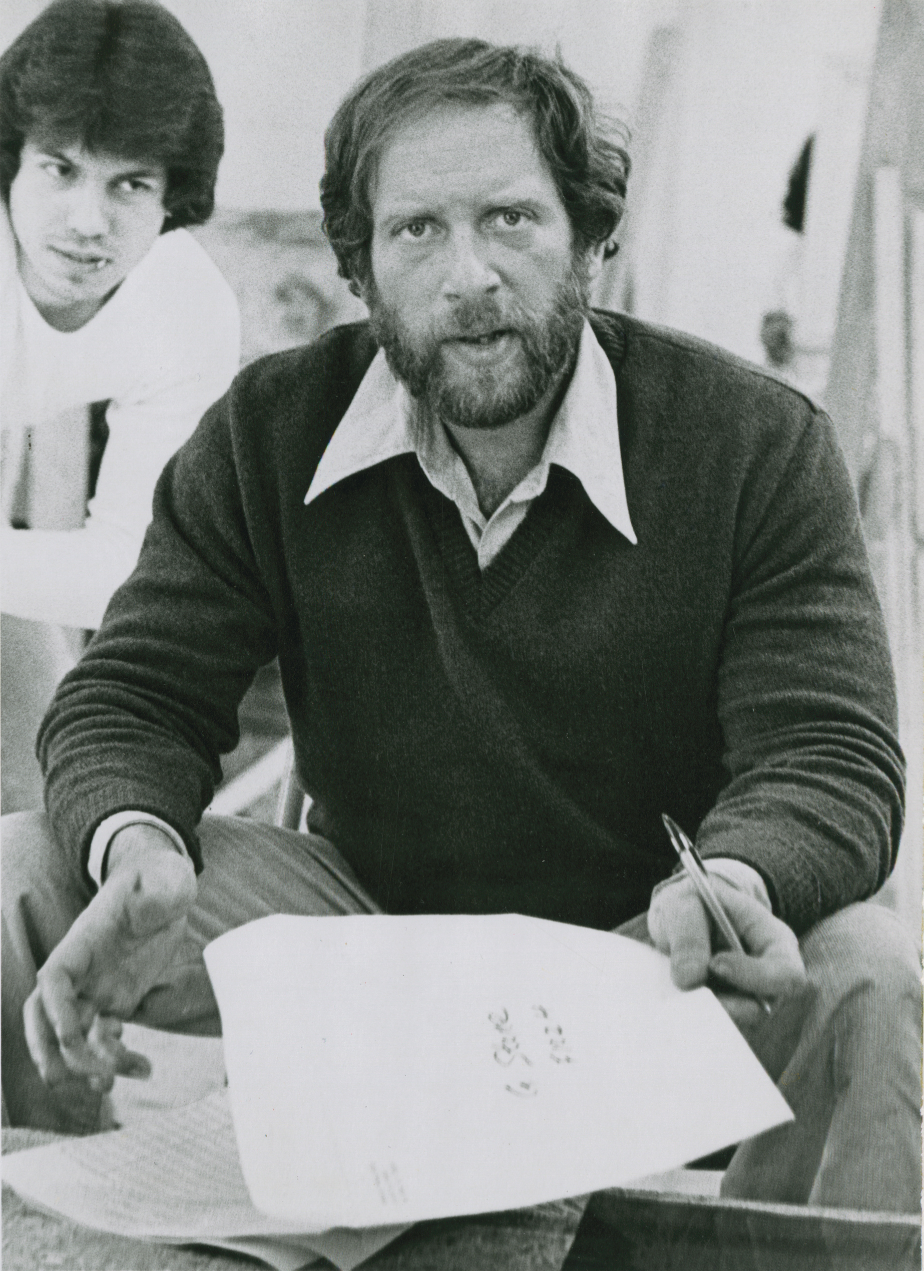 Black and white photo of bearded Gil Stone looking directly at the camera